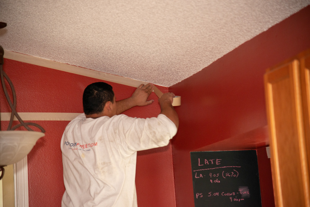 Worker Taping Ceiling